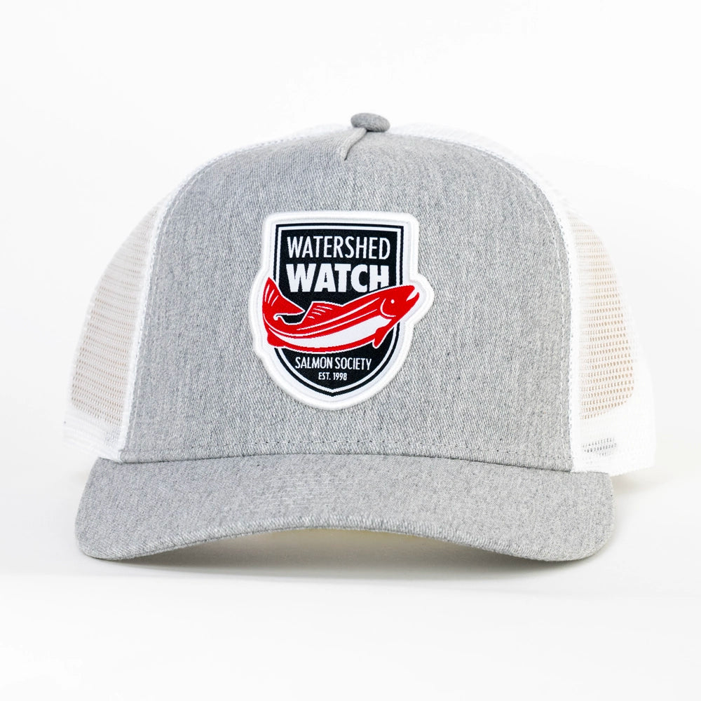 A Heather Grey / White trucker hat with white mesh side panels and a front patch reading 'WATERSHED WATCH' and 'SALMON SOCIETY EST. 2016' with a red fish graphic, shown on a white background.