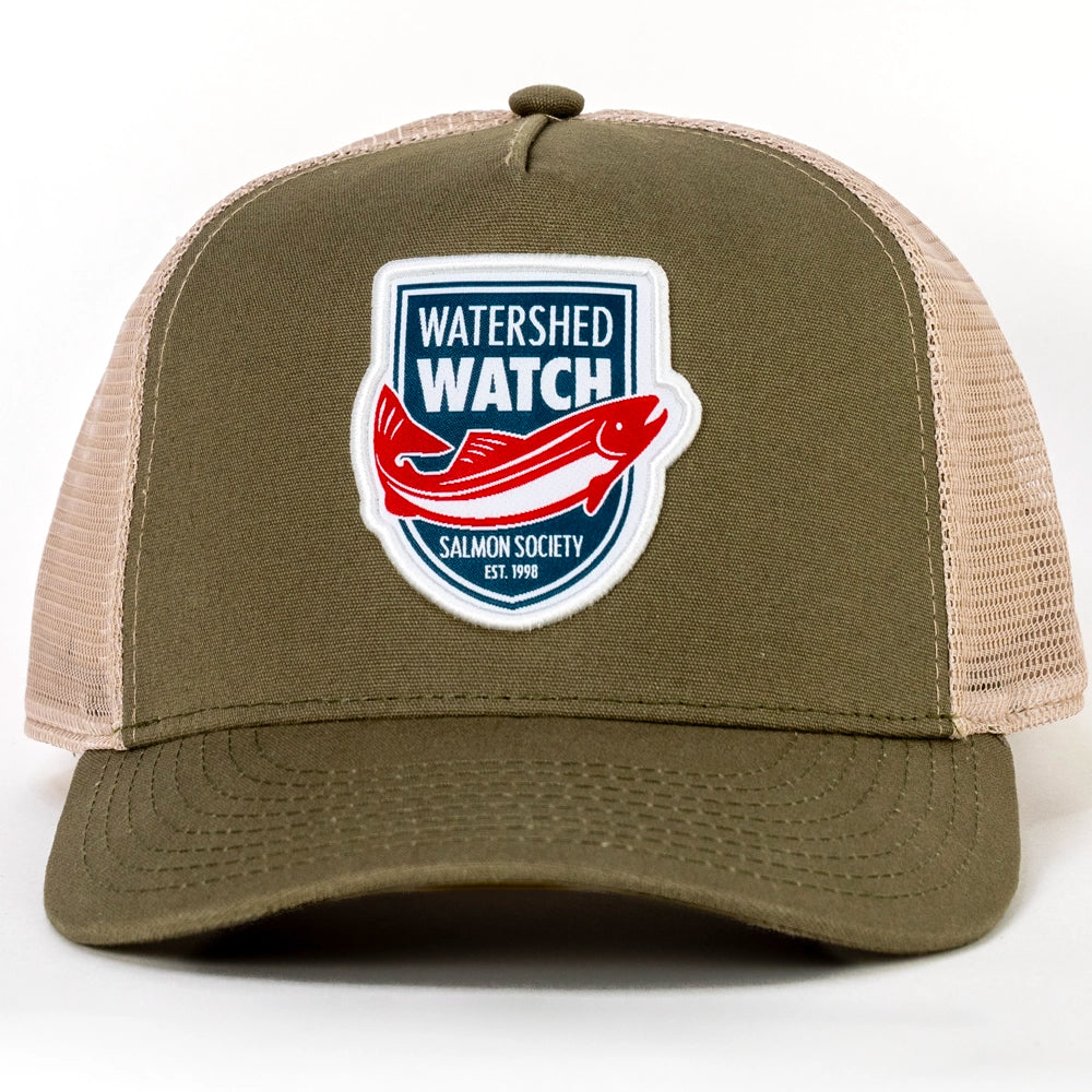 An Olive / Khaki trucker hat with a 'Watershed Watch Salmon Society' embroidered patch on the front, set against a plain white background.